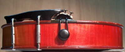 Position of a chin rest lateral of violin.